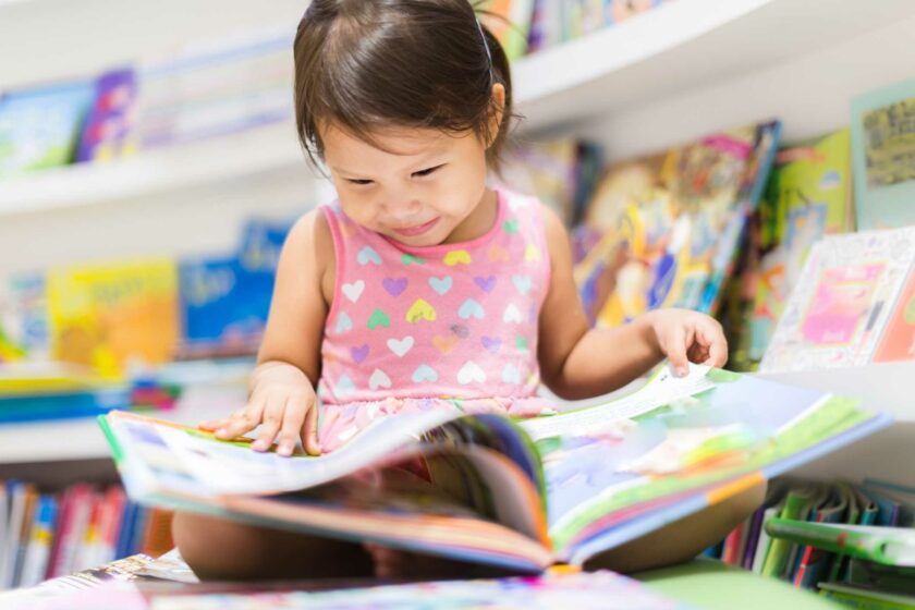 Little Girl Reading Book.